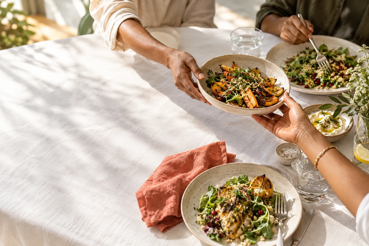 Friends sharing food around a restaurant table